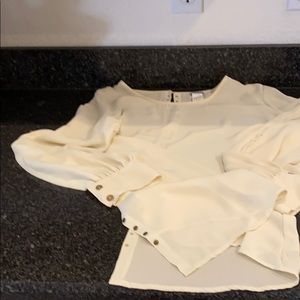Long sleeve cream color blouse by Charming Charlie